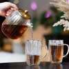 Dzbanek ze stalowym zaparzaczem Vialli Design Tulip, 1 l, z podwójną ścianką, złoty mat